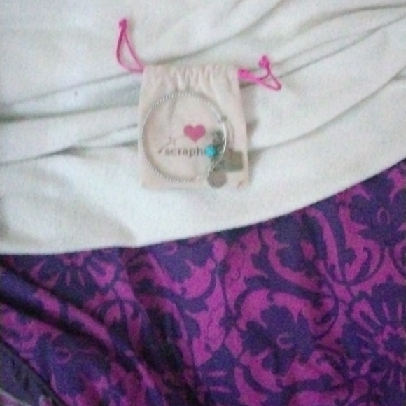 I'm am selling a black 14 /16 size black dress with a bow a hockey a green purse - Picture 4 of 5